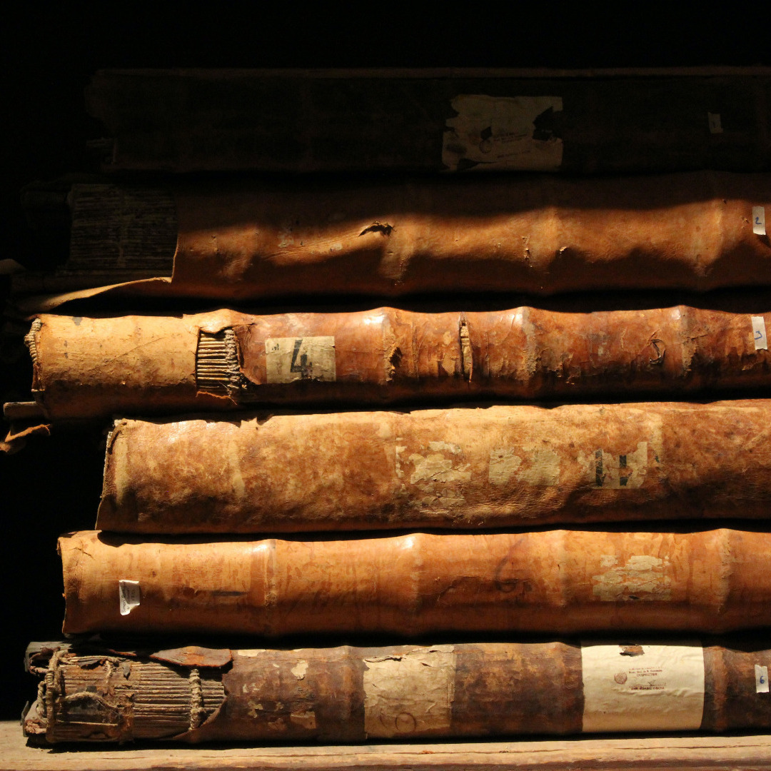 Stack of aged oversized bound register books